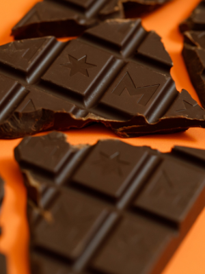 Montezuma's HAPPY HIPPY - DARK CHOCOLATE WITH ORANGE & GERANIUM